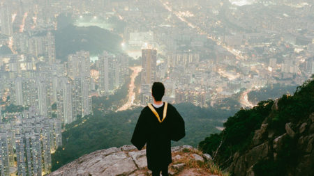 student overlooking city