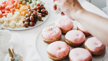 hand reaching for donuts