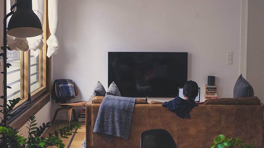 woman sitting on couch in living room